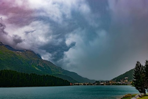 Panoramic View over City and Lake Sankt Moritz and Mountain Valley with Beautiful Storm Clouds in a