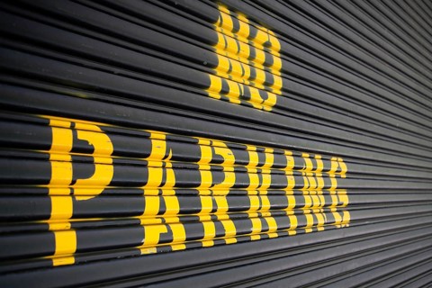 Steel roller garage door with the inscription No Parking
