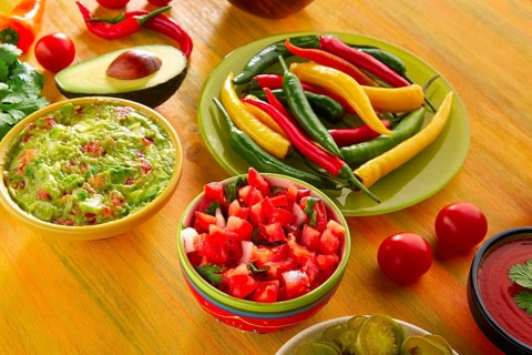 Mexican food mixed guacamole nachos chili sauce dipping cheddar cheese lemon pico de gallo