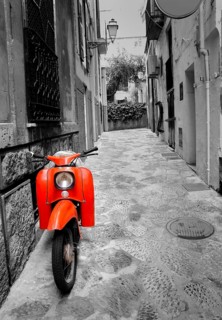 Mediterranean street with old retro red scooter in Palma de Mallorca Spain