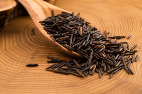 Wild rice on wooden spooon