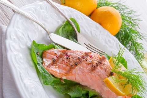 Grilled salmon fillets on spinach