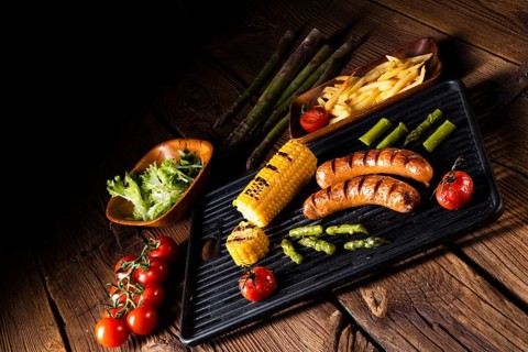 Grilled krakauer with french fries and green salad