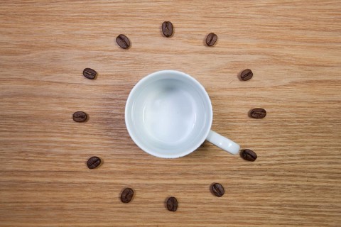 Coffee Time - Empty coffee cup and clock of coffee beans