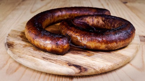 Fried Sausages On a Wooden Board
