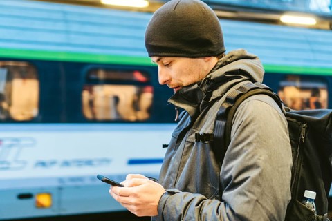 Train Station in Sopot, Poland, Europe. Attractive man waiting at the train station. Thinking about