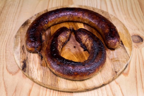 Fried Sausages On a Wooden Board