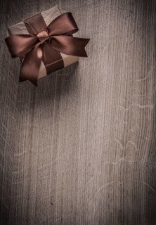 Vintage present box on wooden board holiday concept copyspace