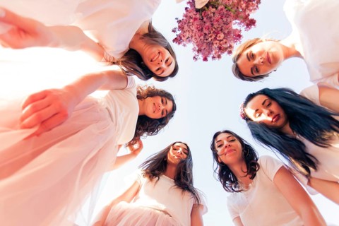 Happy young bridesmaids looking down together. Happy Hen party