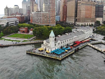 Aerial view of Battery Park pier A leading to Liberty Island, people can be seen waiting in line
