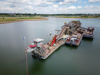 Gravel and sand extraction at the river Rhine using a gravel extractor