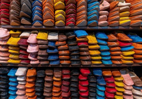 Fez, Morocco, 4 March, 2024: detail view of shelves full of colourful leather shoes and slippers in