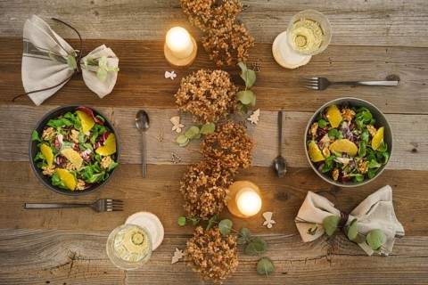 Christmas menu with salad with field salad, walnuts, orange fillets and radicchio