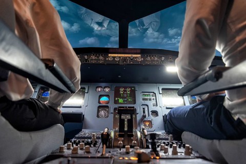 Pilots in the cockpit of an aircraft during a flight