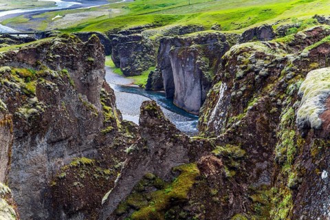 Iceland. The beautiful and mysterious canyon Fyadrarglyufur. Cloudy summer day. River with glacial