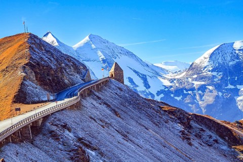The famous panoramic mountain road Grossglocknerstrasse. Snow-capped mountain peaks are covered