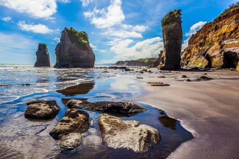 Exotic journey to the end of the world. North Island, New Zealand. Famous rocks Three Sisters on