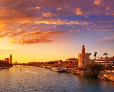 Seville sunset skyline torre del Oro in Sevilla Andalusia Spain