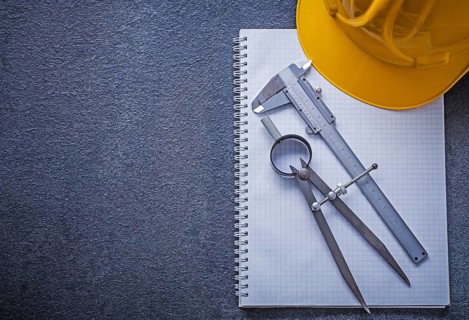 Notebook building helmet drawing compass slide caliper construction concept