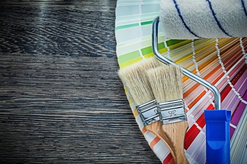 Paint brushes roller color pantone fan on wooden board