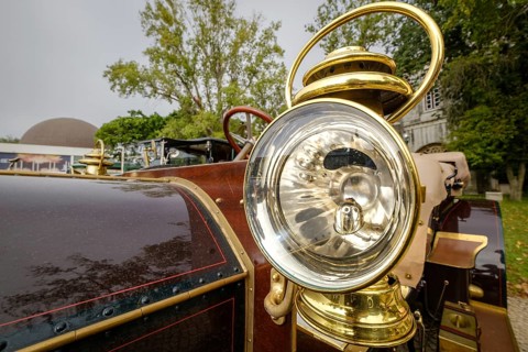 Lisbon, Portugal - Oct 15, 2023: Detail of 1904 Mercedes Simplex - external headlight in brass
