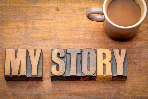 My story word abstract in vintage letterpress wood type against grunge wooden board