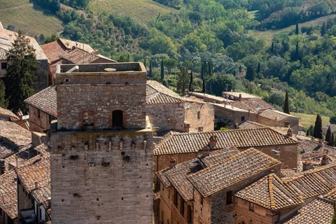 Wide panoramic view over downtown San Gimignano, Torre del Diavolo in the center, seen from Torre