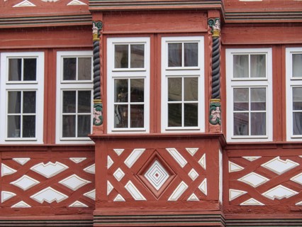 Half-timbered façade with red struts, spiral columns and decorative geometric patterns, Mainz,