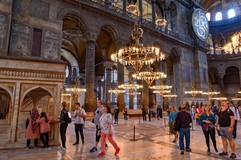 Tourists inside Hagia Sophia, former Orthodox cathedral and Ottoman imperial mosque, in Istanbul,