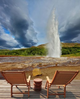 Pillar of hot water and steam from forcing its way out of the ground. Geyser Strokkur in Iceland.