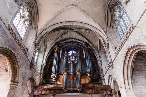 Vannes, France, August 6, 2018: Pipe organ and vaults of the Cathedral of Vannes. It is a Roman
