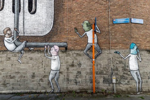 Large wall graffiti on the brick wall of buildings in Craenendonck Street, Leuven, Flanders,