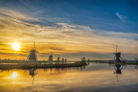 Rotterdam Netherlands, sunrise nature landscape of Dutch Windmill at Kinderdijk Village