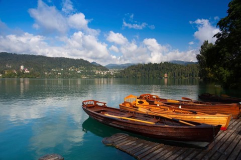 Typical wooden boats at the pier of the Bled Island, Lake Bled, Slovenia, Europe