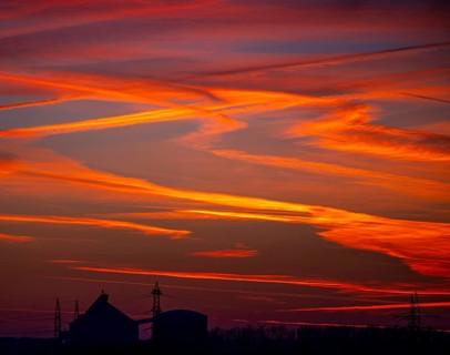 Sunset with red-coloured sky and contrails, Braunschweig, Lower Saxony, Germany, Europe