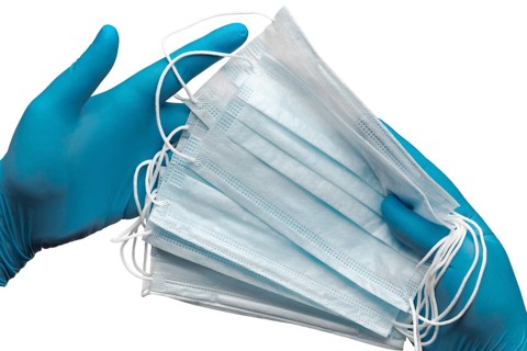 Doctor holding lot medical face mask in two hands blue gloves isolated on white background. Concept