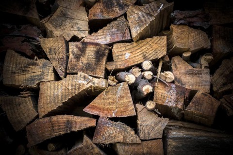 Lumber of various sizes stacked as a spare for the winter