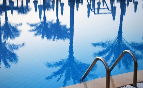 Swimming pool in touristic resort during summer time