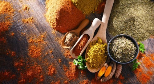 Composition with spices on wooden kitchen table