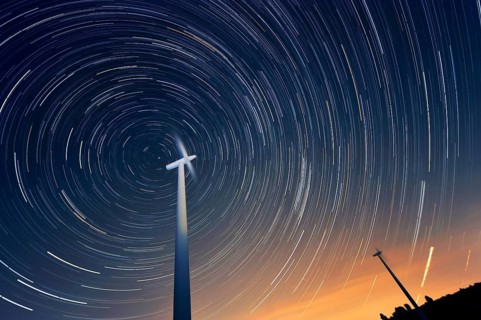 Wind turbines against the night sky
