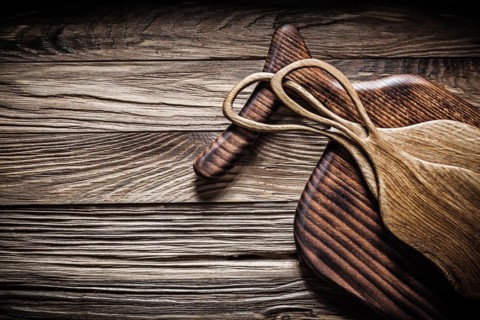 Close-up of cutting and serving boards on old wood