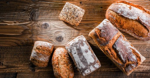 Composition with assorted bakery products on wooden table