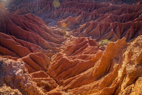 Red hills of Tatacoa Desert bathed in sunlight in Huila, Colombia, South America