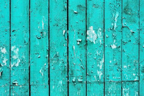 Old boards with cracked cyan paint. Textured wooden old background with vertical lines. Cyan wooden