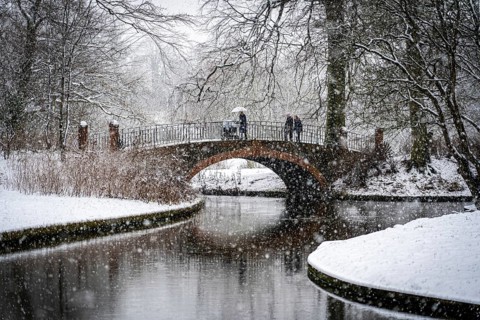 Copenhagen, Denmark, January 06, 2021: People enjoying a snowy winter day in Frederiksberg Gardens,