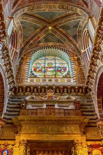 Siena Italy, October 25, 2018: Wall, stained-glass window and ceiling decorations in Siena