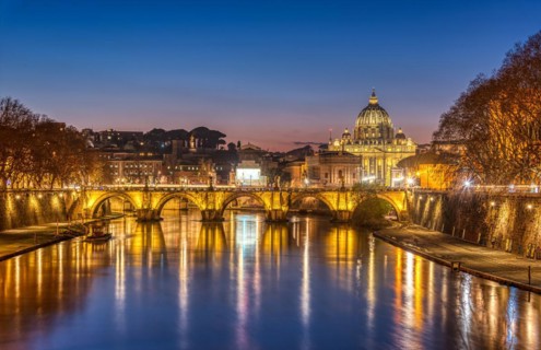 The Tiber and the Basilica of St. Peter in Vatican City, Italy, at dusk, Europe
