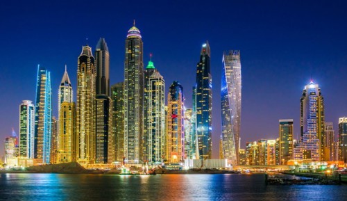 Modern residential architecture of Dubai Marina, United Arab Emirates. City skyline by night