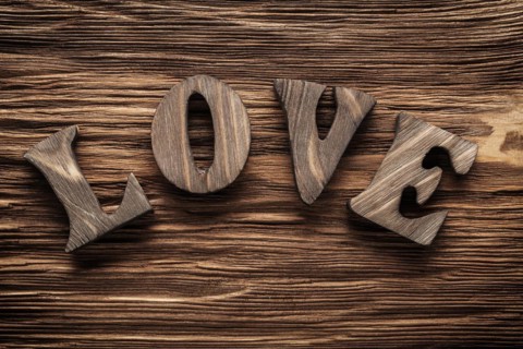 Love vintage wood letters on wooden background
