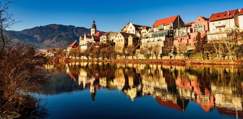 Frohnleiten panorama small city above Mur river in Styria, Austria. View at Parish church, town and